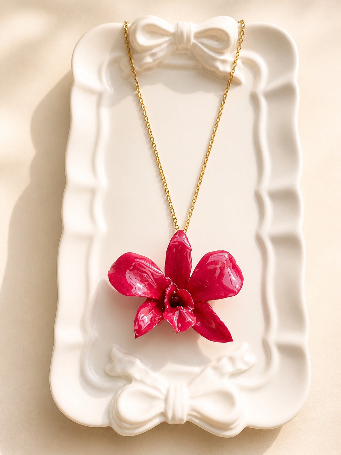 Genuine orchid flower necklace featuring a preserved bloom for everyday wear and gifting.