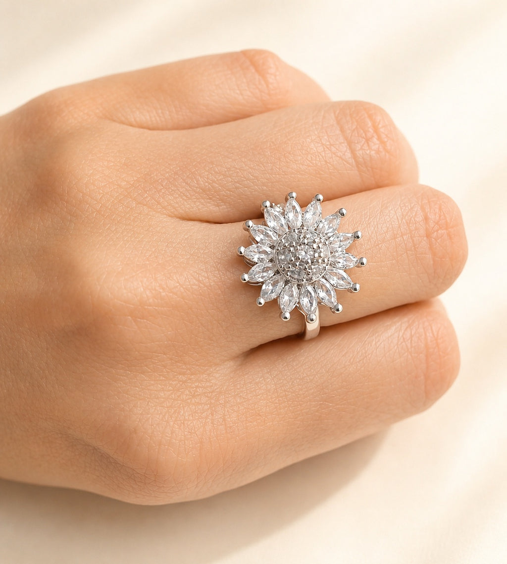 Adjustable anxiety spinner ring with a delicate flower motif.