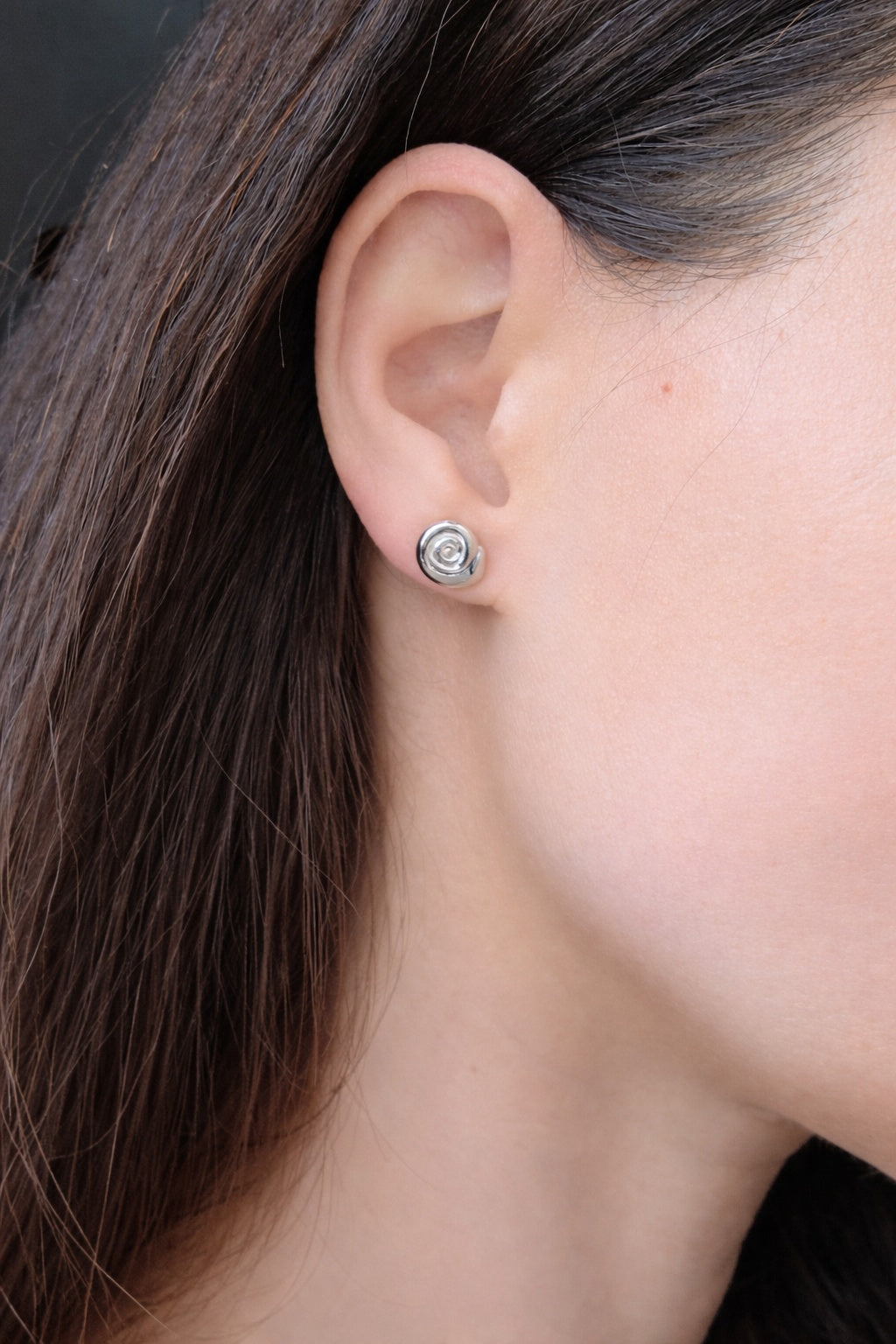 Gold spiral stud earrings for everyday wear and special occasions.