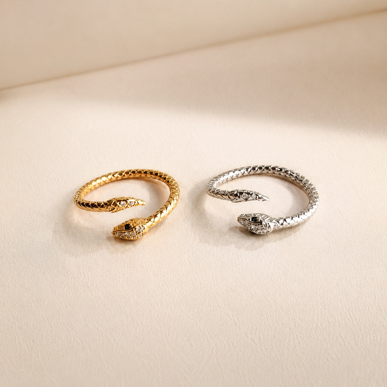 Adjustable snake wrap ring with 18K gold plating and sparkling CZ accents.