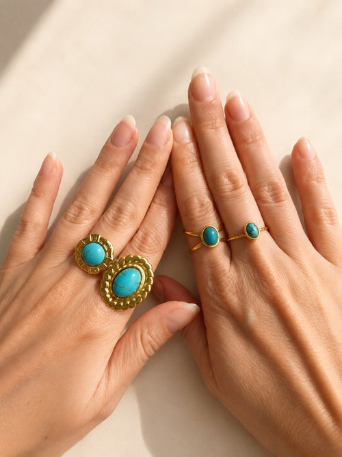 Chunky turquoise ring with 14K gold plating and a non-tarnish finish.