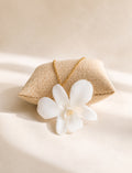 Botanical orchid necklace crafted with a real preserved flower on an 18K gold-plated chain.