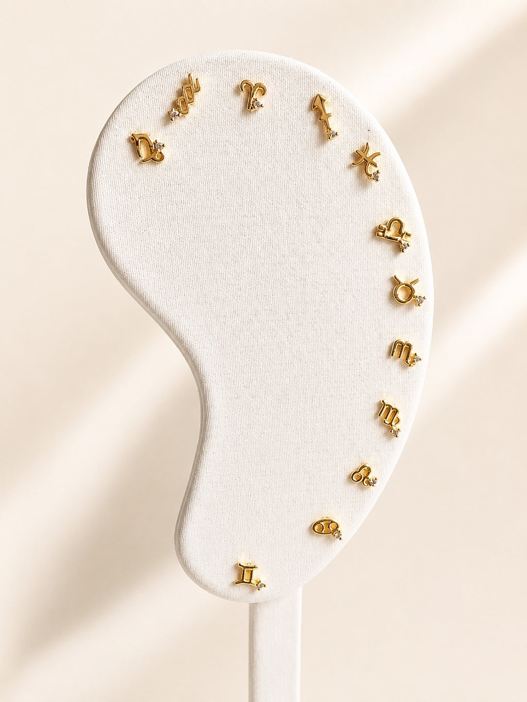 Zodiac flat back stud earring with 18K gold plating and a hypoallergenic design.